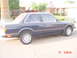 1992 Ford F-150 - Side view of a dark blue coupe with a visible timestamp and website watermark.