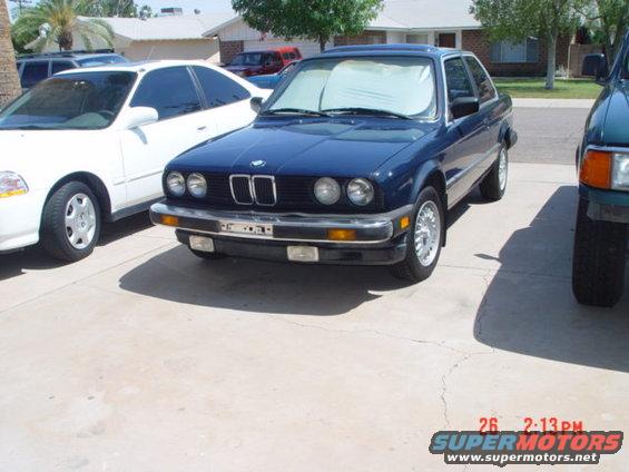 Blue BMW coupe, 3q-front view. Visible grille suggests 1992 model year