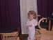 1992 Ford F-150 - A young child in striped pajamas stands indoors next to furniture.