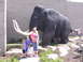 1992 Ford F-150 - A family poses for a photo in front of a large mammoth statue outside a museum.