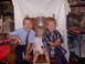 1992 Ford F-150 - Three children, two boys and a girl, are seated and smiling for a photograph taken indoors.