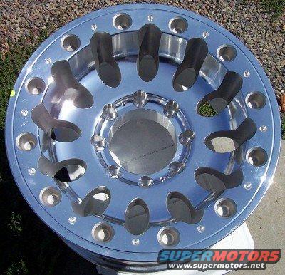 Chrome wheel with cutouts and multiple bolt holes