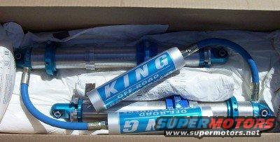Box of King Off-Road shock absorbers with blue hoses