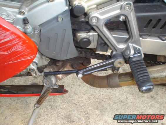 Motorcycle rear brake lever and exhaust pipe