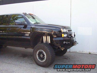 Black lifted truck with custom bumper and visible suspension components