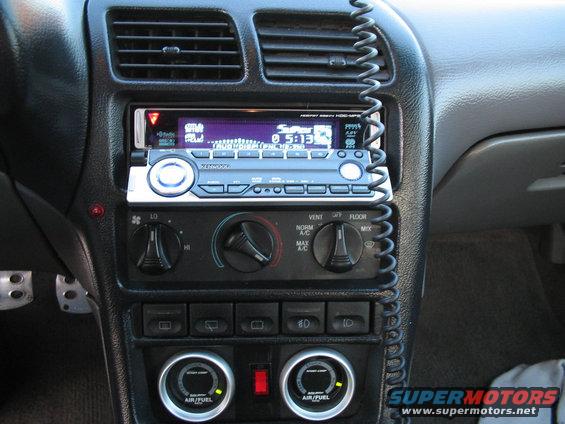 Car interior dashboard with Kenwood stereo, climate controls, and air/fuel gauges