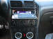 1993 Ford Probe - The interior dashboard features an aftermarket stereo and auxiliary gauges, with no clear year identification.