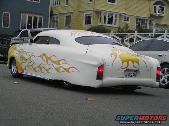 White hot rod with yellow and orange flame decals, custom body, and California license plate WIE298