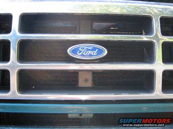 black-grill-008.jpg little screw here in addition to the four on top, easy to miss.  I happened about it while looking at my trans fluid cooler.  