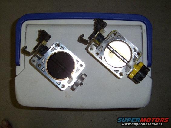 New ported factory throttle body next to old