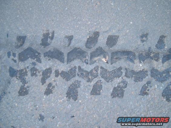Tire tread impression on asphalt
