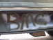 1988 Ford Bronco - Graffiti spelling 'BRONCO' is visible on the lower body panel of a vehicle.