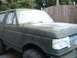 1988 Ford Bronco - This Ford Bronco is covered in masking tape and primer, indicating it is being prepped for a new paint job.