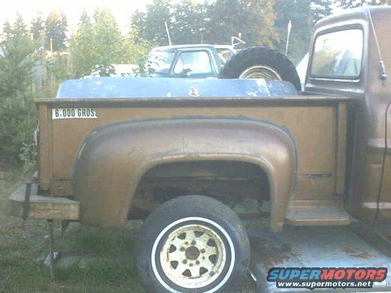 1972 Ford F-100 pickup truck, brown, with another truck behind it