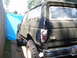 1988 Ford Bronco - The rear of a modified SUV, possibly a Ford Bronco, is shown with its windows covered in plastic sheeting.