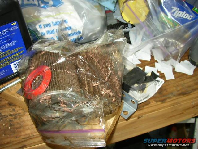 Oil filter in a plastic bag with a red ring