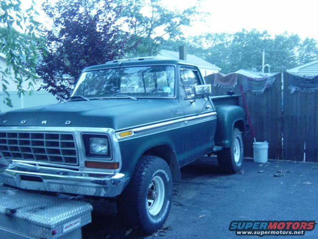 Dark green 1979 Ford pickup truck, front 3/4 view
