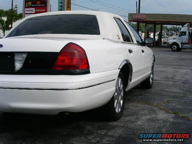 2001 Ford Crown Victoria rear quarter view, parked at a gas station