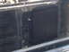1982 Ford Bronco - Close-up of an aftermarket oil cooler installed in front of a radiator.