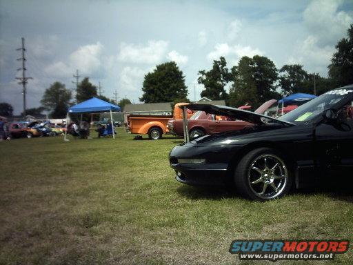 Black 1995 Ford Probe, 3q front view, hood open. Chrome wheels