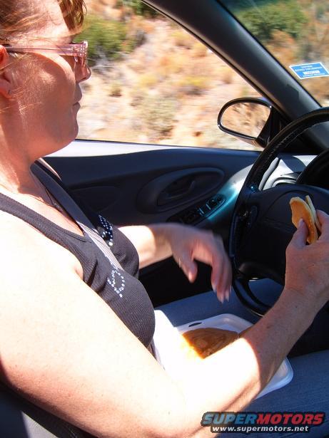 Jackie driving through the curvey mt.'s and eating her breakfast