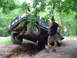 1979 Ford Bronco - Off-road SUV with lifted suspension is tilted precariously while navigating a ditch.