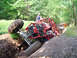 1979 Ford Bronco - This custom off-road buggy appears to be stuck in a ditch while navigating a wooded trail.