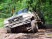 1979 Ford Bronco - Ford Bronco stuck in mud on an off-road trail.