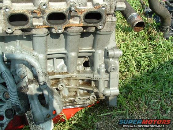 Engine block with cracked casing and visible damage