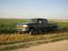 1996 Ford F-350 - 1996 Ford F-350 Super Duty crew cab pickup truck parked beside a field under a clear sky.