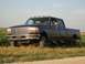 1996 Ford F-350 - This truck appears to be from the mid-1990s, likely a Ford F-250 or F-350, with a crew cab and long bed.