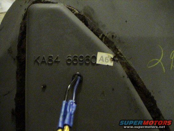 close-up of a dark-colored part with embossed numbers KA84 66960 and a sticker labeled A6