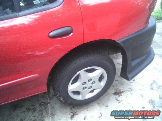 Red 2005 Chevrolet Cavalier rear side view with black trim
