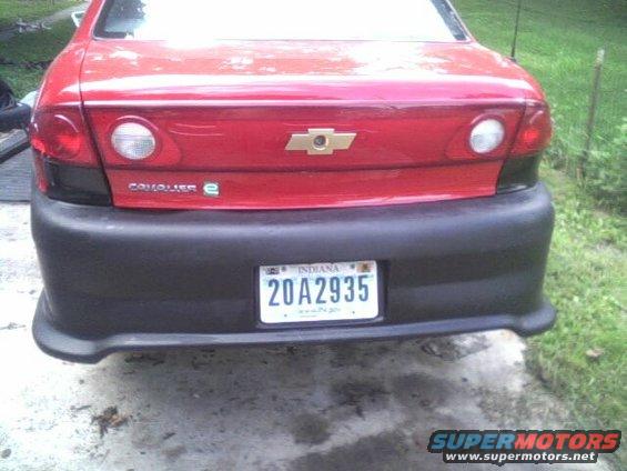 Red 2005 Chevrolet Cavalier rear with black bumper and Indiana license plate 20A2935