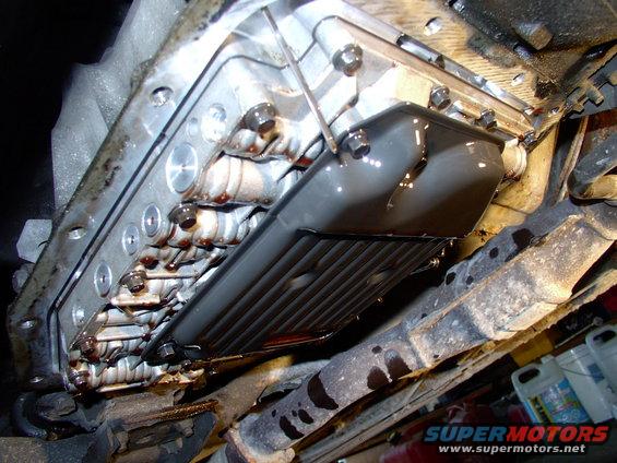 In this dandy shot you can see all three of the 8mm bolts holding the filter on and the dipstick still probing for ATF. 