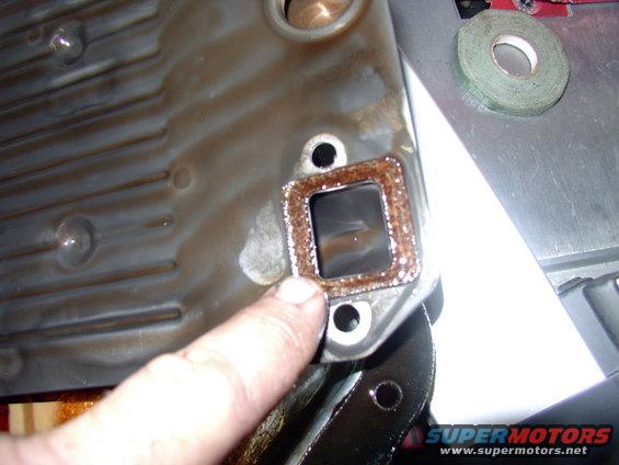 Make sure you put the new filter to valve body gasket on or you'll get no fluid suction.  What you don't see, in the large round hole just above my finger is......