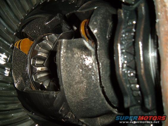 close-up of damaged differential gears with metal shavings
