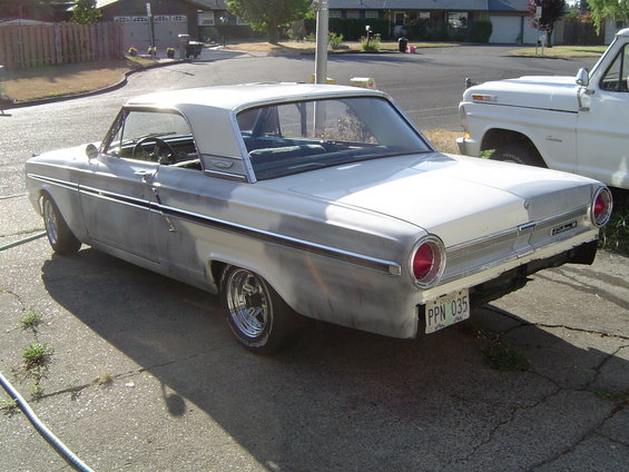 1964 Ford Fairlane, rear 3/4 view, primer gray and white
