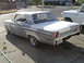 1964 Ford Fairlane - 1964 Ford Fairlane in primer gray and white, seen from the rear 3/4 angle.