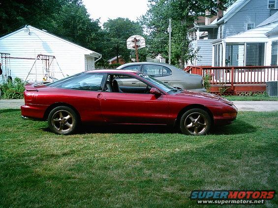 imag0049.jpg with bronze wheel paint and new muffler b4 the drop.