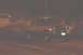 1994 Ford F-150 - Pickup truck with American flag is seen driving at night, with a trailer behind it.