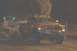 1994 Ford F-150 - A Dodge pickup truck emits a large cloud of dark smoke while pulling a trailer at night.