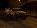 1994 Ford F-150 - A modified pickup truck is seen at night, possibly participating in a pull or drag event.