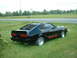 1978 Ford Mustang II - Black 1978 Ford Mustang II coupe with distinctive rear window louvers sits on a grassy area.