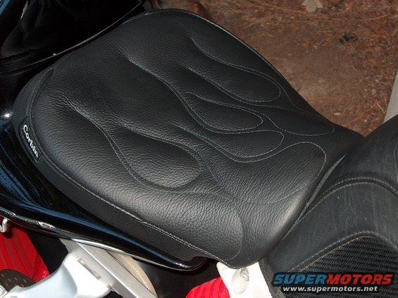 Black Corbin motorcycle seat with flame stitching, close-up side view