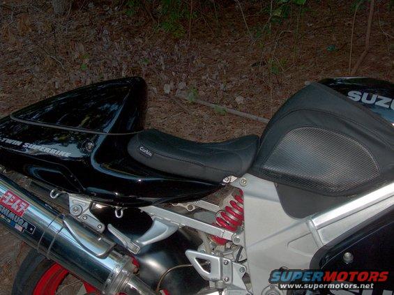 Close-up of a motorcycle's Corbin seat and Yoshimura exhaust pipe