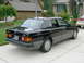 1990 Mitsubishi Eclipse - Rear view of a black Mercedes-Benz 190E 2.3 sedan parked in a driveway.