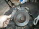 1979 Ford Bronco - A close-up view of a power steering pump, likely removed from a vehicle for repair or replacement.