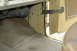 1972 Ford Bronco - The interior door sill of a vehicle shows signs of rust and wear on the carpet.