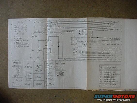 Folded wiring diagram with text and electrical schematics